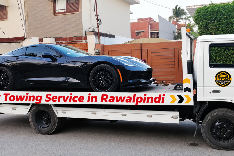 Car towing service in Rawalpindi with a luxury car loaded on a flatbed tow truck.
